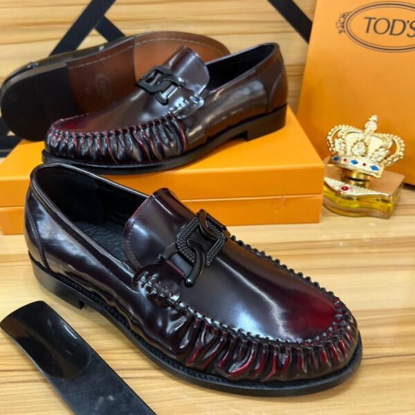 Tod’s Burgundy Patent Leather Loafers